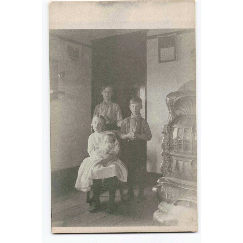 RPPC 1920 Bullock Family Four Children Ornate Parlor Stove Real Photo Postcard